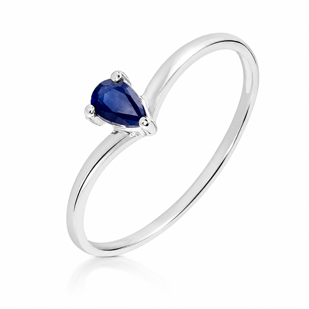 Anillo de oro blanco 18k con zafiro azul en forma de pera. 