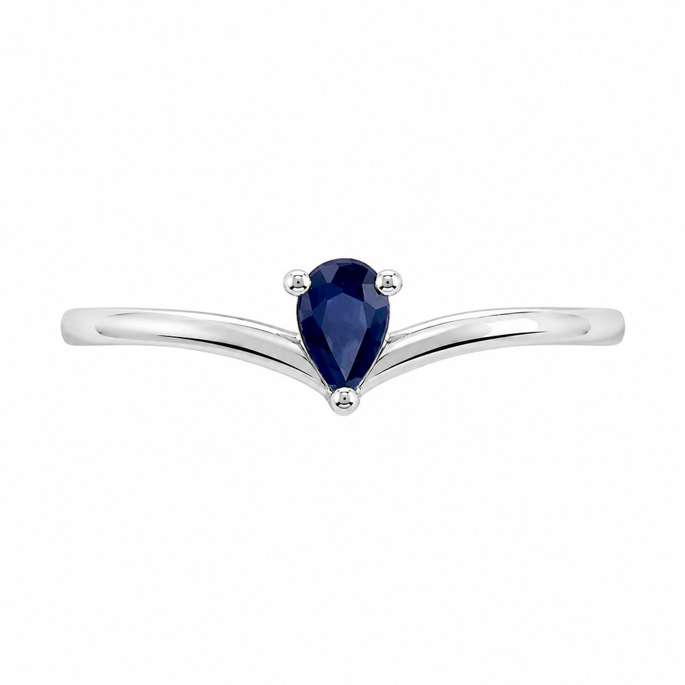 Anillo de oro blanco 18k con zafiro azul en forma de pera. 