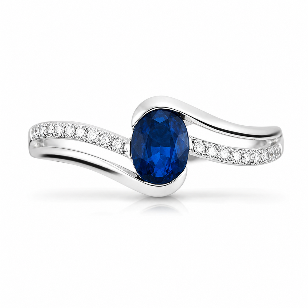 Anillo de zafiro azul en oro blanco con diamantes