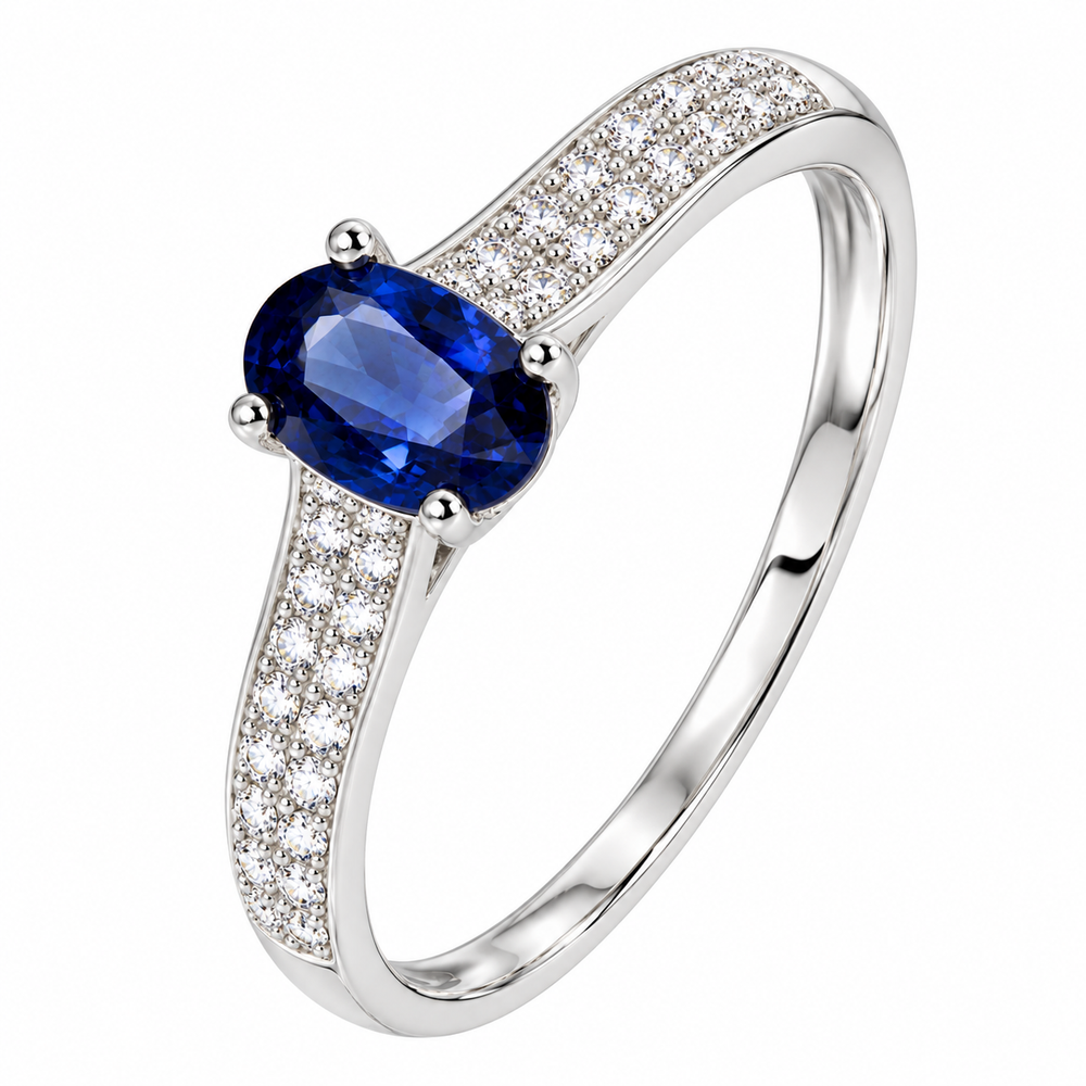 Anillo de compromiso con zafiro azul natural ovalado y diamantes naturales. 