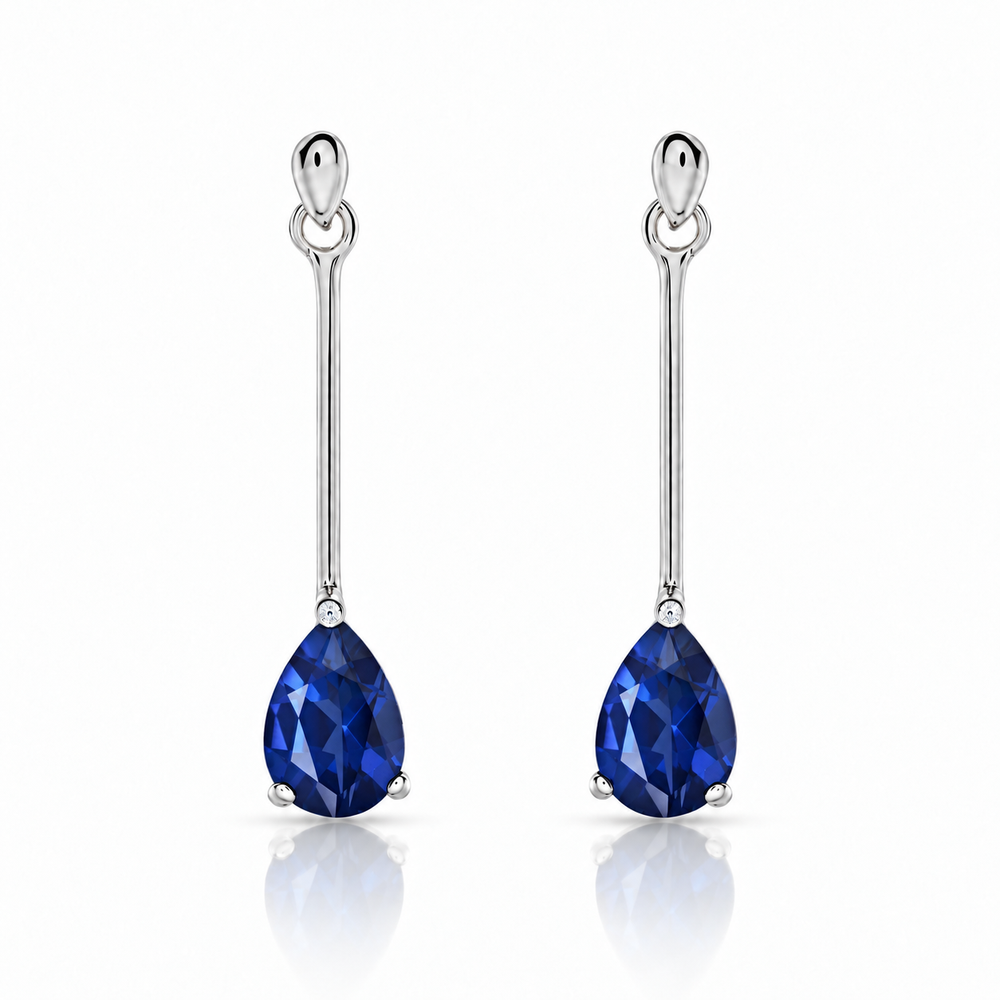 Aretes de oro blanco 18k con zafiros naturales en forma de pera. 