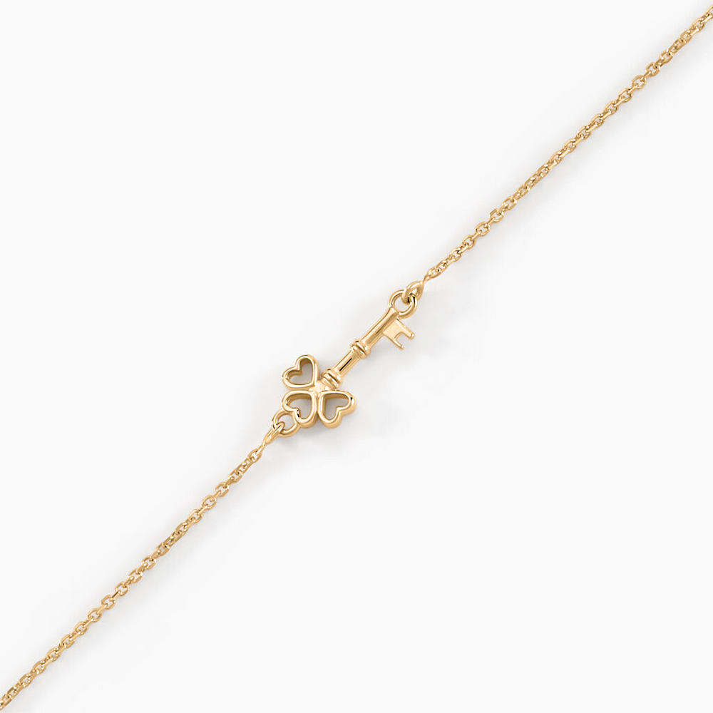 Pulsera Trinidad oro amarillo 18k con dije en forma de llave – Juli & Co