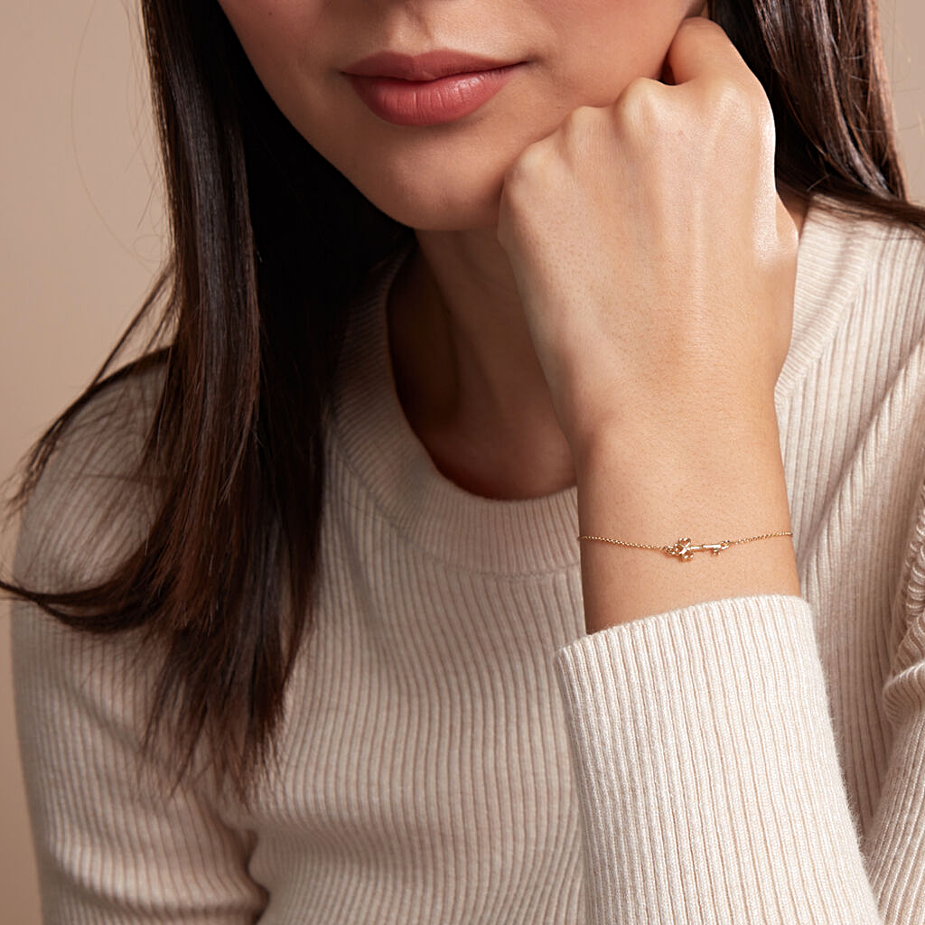 Pulsera Trinidad oro amarillo 18k con dije en forma de llave – Juli & Co