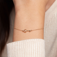 Pulsera Trinidad oro amarillo 18k con dije en forma de llave – Juli & Co