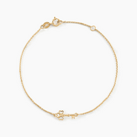 Pulsera Trinidad oro amarillo 18k con dije en forma de llave – Juli & Co