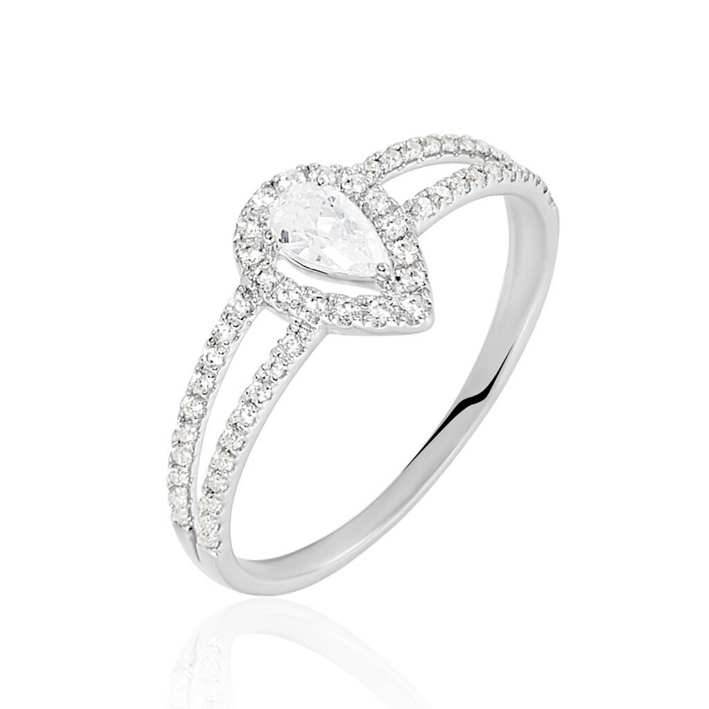 Anillo de compromiso: Oro blanco, diamante pera rodeado por un halo de diamantes. ¡Destaca tu amor con estilo!