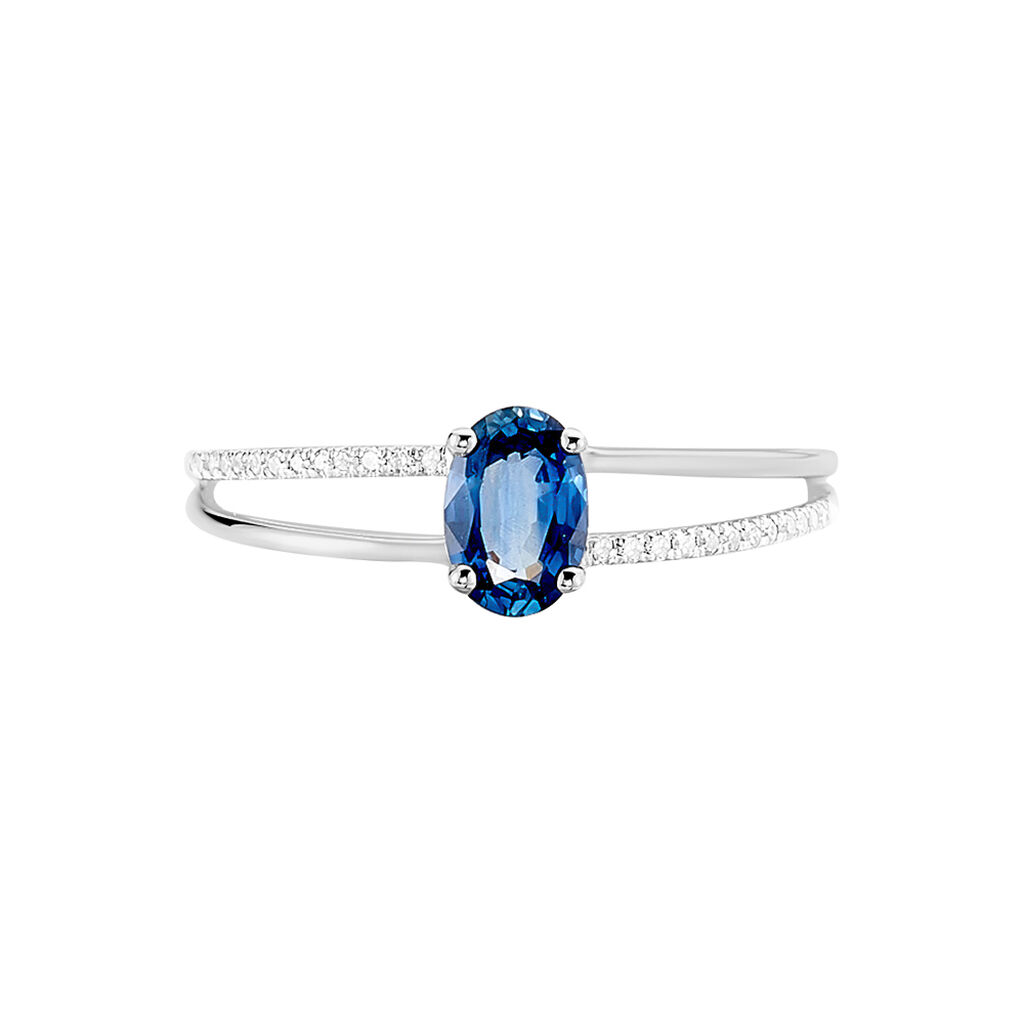 Anillo de Oro Blanco con Zafiro Azul Ovalado y Detalles de Diamantes